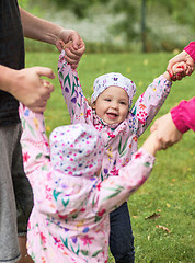 Image showing The two little baby girls playing in autumn park