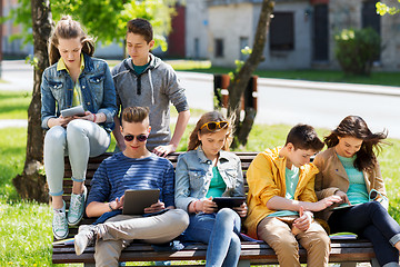 Image showing group of students with tablet pc at school yard