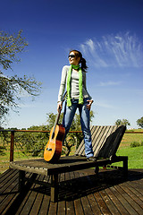 Image showing Woman with a guitar