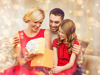 Image showing happy family opening gift box