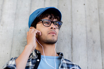 Image showing man with earphones listening to music on street