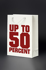 Image showing white shopping bag up to 50 percent