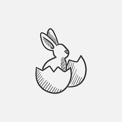 Image showing Easter bunny sitting in egg shell sketch icon.