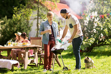 Image showing friends making barbecue grill at summer party