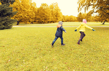 Image showing group of happy little kids running outdoors