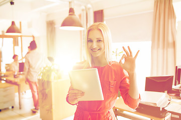 Image showing woman with tablet pc showing ok sign at office