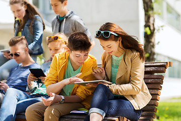 Image showing group of students with tablet pc at school yard