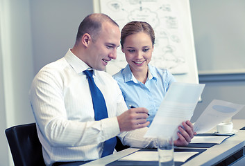 Image showing business people with papers meeting in office