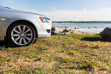 Image showing close up of car parked on sea shore or beach