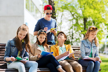 Image showing group of students with notebooks at school yard