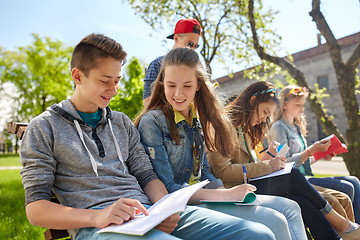 Image showing group of students with notebooks at school yard