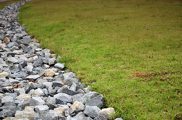 Image showing Stone and green grass