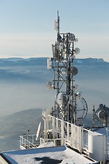 Image showing Transmitter towers on a hill in winter