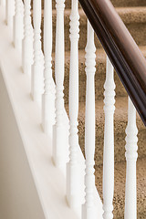 Image showing Abstract of Stair Railing and Carpeted Steps in House