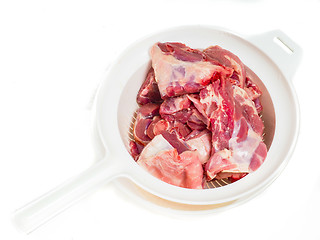 Image showing Fresh red lamb meat in a colander after rinsing in water