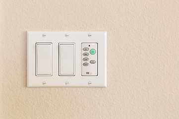 Image showing Light Switches and Fan Control on Wall