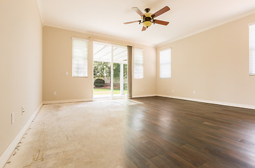 Image showing Room with Gradation from Cement to Hardwood Flooring