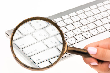 Image showing Laptop with a magnifying glass