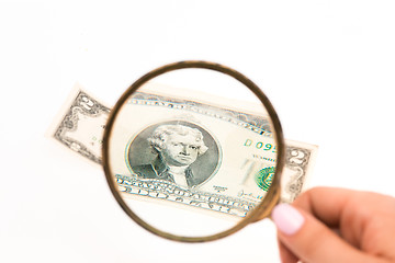 Image showing Two dollars bill and magnifying glass