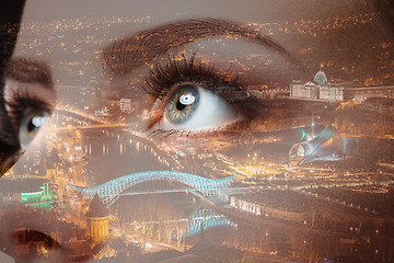 Image showing Photo of woman eye and city night lights. Double exposure