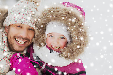 Image showing happy family in winter clothes outdoors