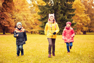 Image showing group of happy little kids running outdoors