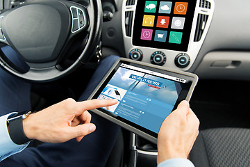 Image showing close up of man with tablet pc in car