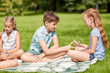 Image showing happy kids playing rock-paper-scissors game