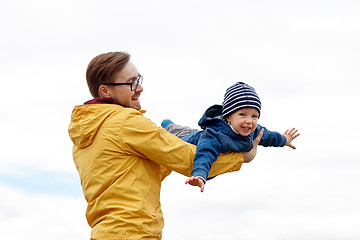 Image showing father with son playing and having fun outdoors