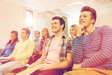 Image showing group of smiling students in lecture hall