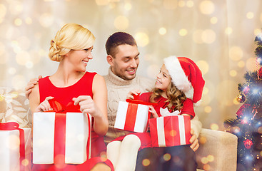 Image showing happy family opening gift boxes