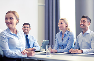 Image showing group of smiling businesspeople meeting in office