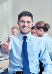 Image showing group of smiling businesspeople meeting in office