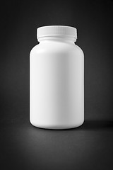 Image showing white plastic jar isolated on black