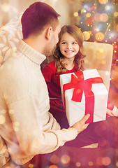 Image showing smiling father and daughter looking at each other