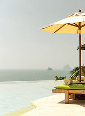 Image showing view from infinity edge pool with parasol to sea