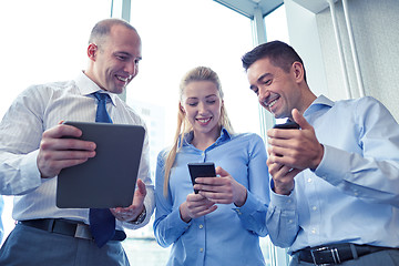 Image showing business people with tablet pc and smartphones