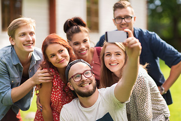 Image showing friends taking selfie by smartphone at summer