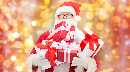 Image showing man in costume of santa claus with gift boxes