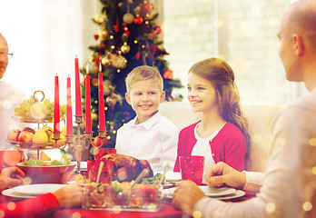 Image showing smiling family having holiday dinner at home