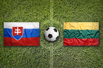 Image showing Slovakia vs. Lithuania flags on soccer field