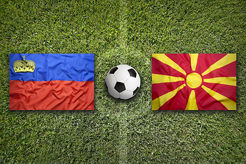 Image showing Liechtenstein vs. Macedonia flags on soccer field