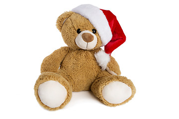 Image showing Teddy bear with Santa Claus hat isolated on white background