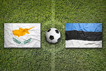 Image showing Cyprus vs. Estonia flags on soccer field