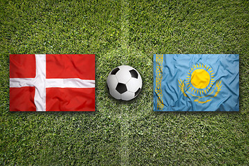 Image showing Denmark vs. Kazakhstan flags on soccer field