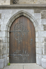 Image showing old wooden door with iron ornaments