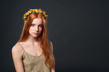 Image showing Beautiful red haired woman in flower wreath