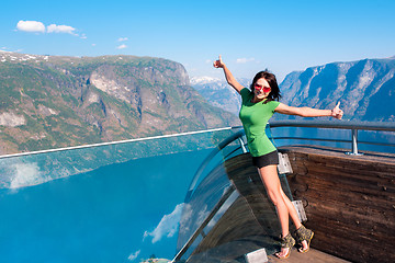 Image showing Excited woman tourist at Stegastein Viewpoint