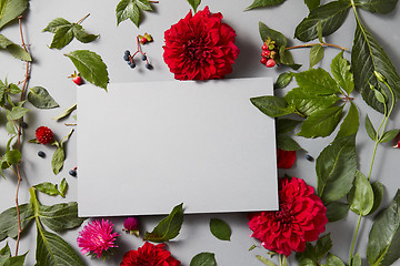 Image showing flowers with empty gray notebook