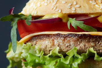 Image showing Fresh burger with beef, cheese and tomatoes.